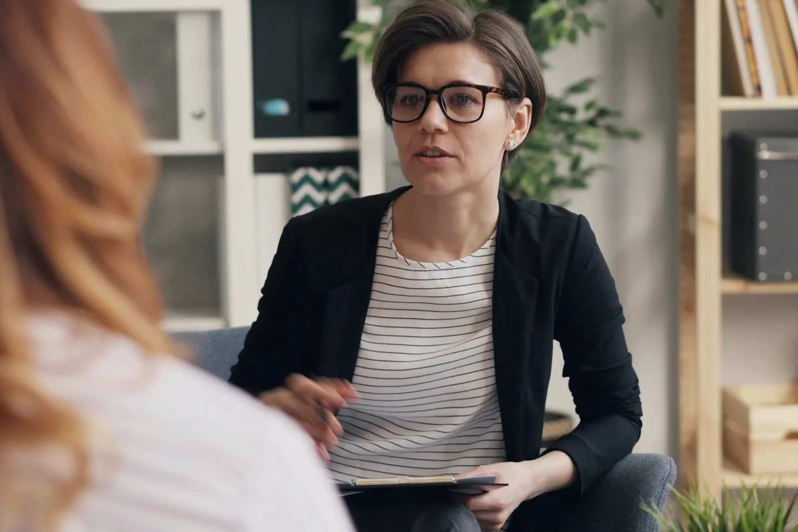 Psychologist in a focused consultation with an adult client or parent