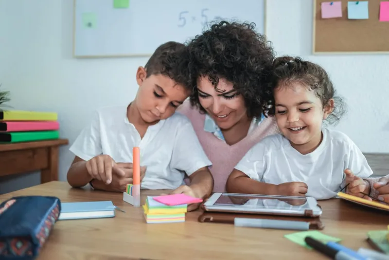 Parent and child working together at home